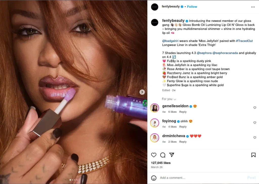 fenty beauty instagram post showing close-up of model with auburn hair applying shimmery purple lip gloss, caption introduces their new gloss bomb oil luminizing lip product in seven shades including miss jellyfish, creating perfect instagram captions for product launches that highlight features and application for the 2025 beauty market